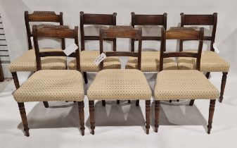 Set of three Regency mahogany brass inlaid dining chairs, each with reeded supports with stuffover