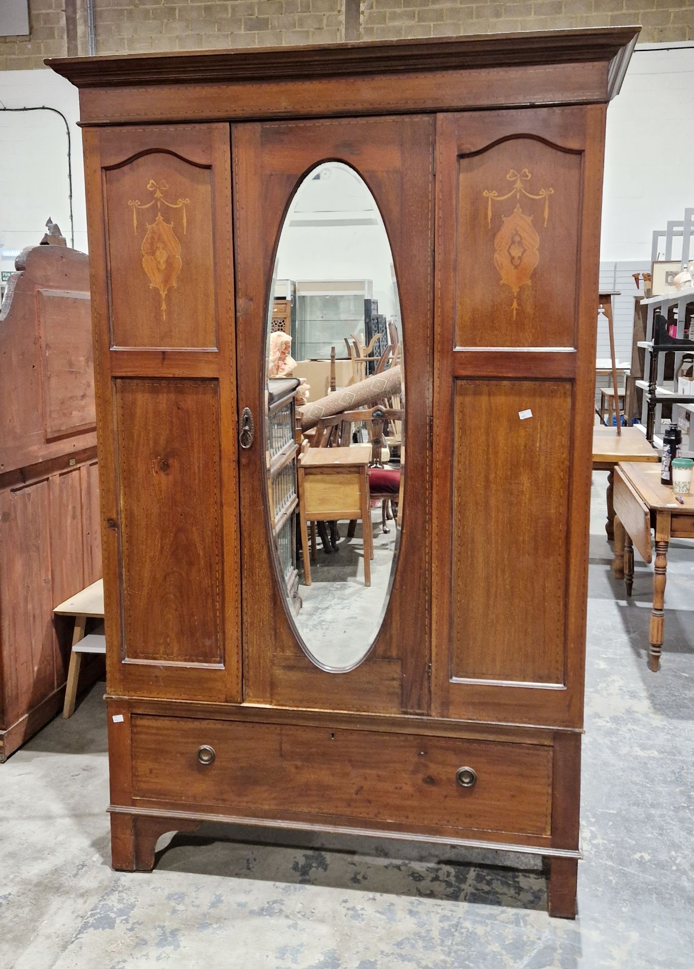 Edwardian mahogany single door wardrobe, the door with oval bevel edged mirror, inlaid marquetry and - Image 2 of 2