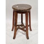 Early 20th century Chinese stool, the circular top raised on four splayed legs joined by