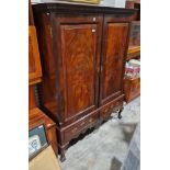 Irish dwarf press, mahogany, with ogee and dentil cornice, stepped frieze, having shelves and