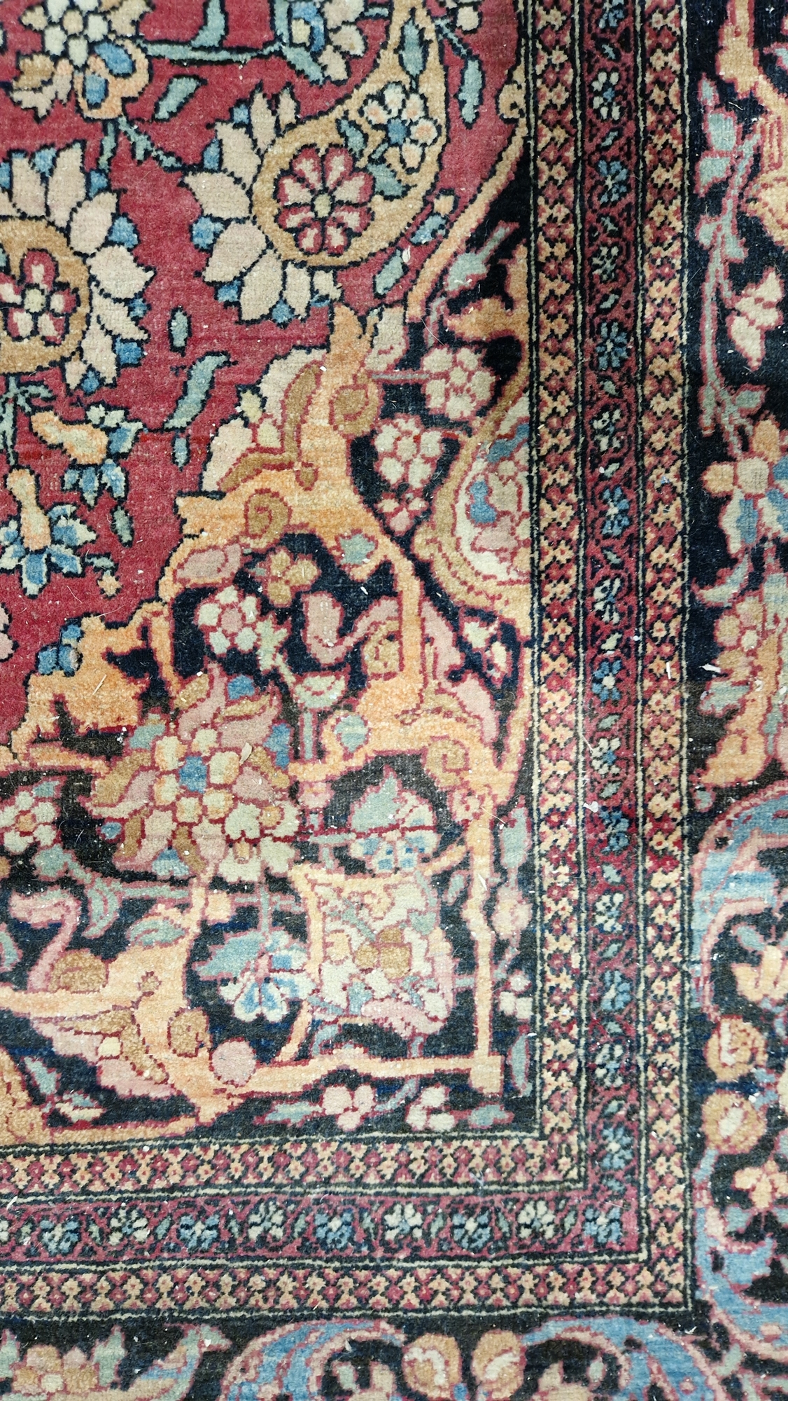 Eastern wool rug of Persian design, having black arabesque to the cherry red field with allover - Image 18 of 32