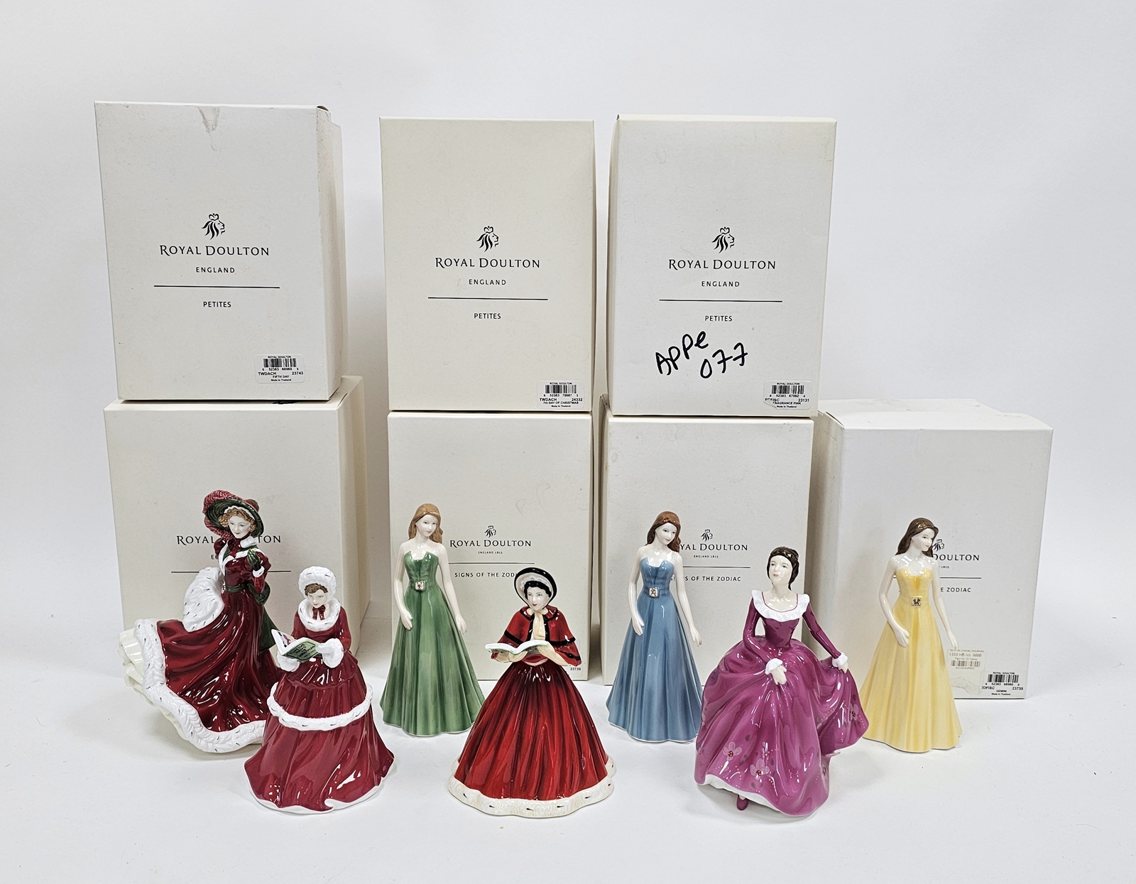 Seven Royal Doulton bone china figures of ladies, in original boxes, including Petits Signs of the