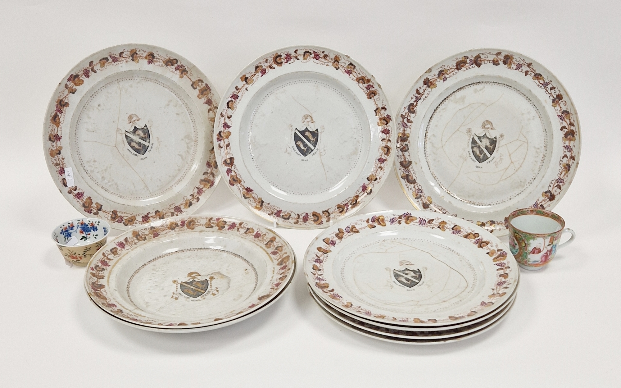 Set of 18th century Chinese export armorial dinner plates, each decorated with a black hatched