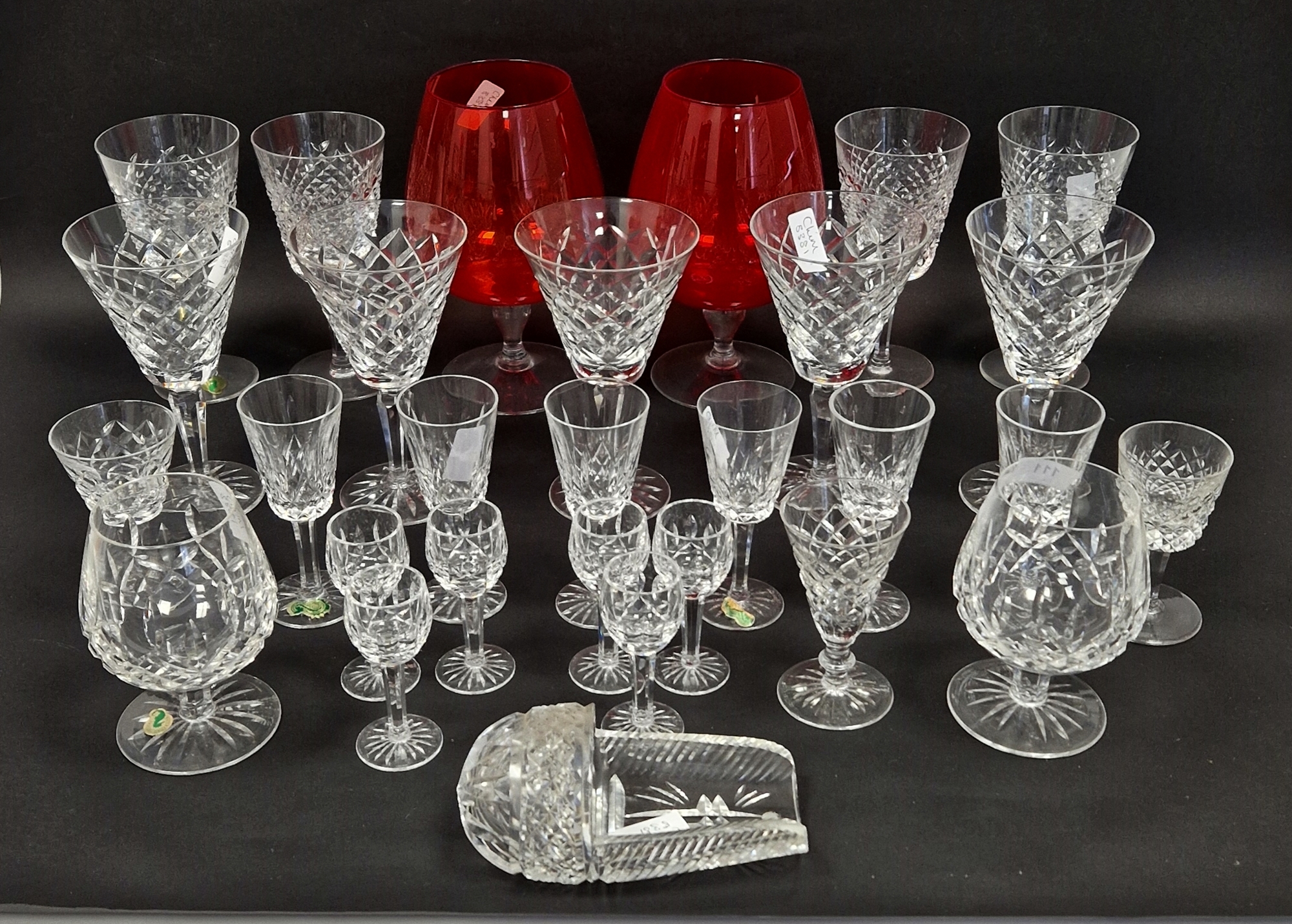 Waterford cut glass part table service with wine glasses in sizes, applied with labels and large