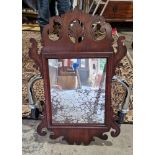 Georgian-style mahogany framed wall mirror with scrolling carved and pierced acanthus motifs and