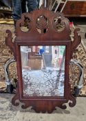 Georgian-style mahogany framed wall mirror with scrolling carved and pierced acanthus motifs and