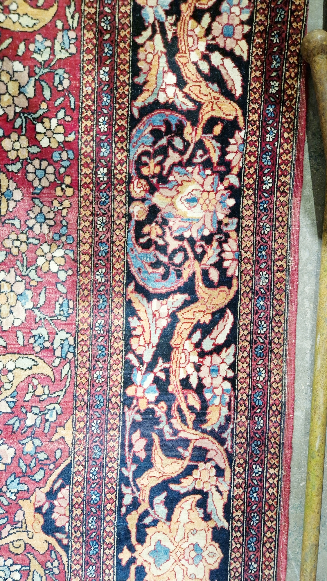 Eastern wool rug of Persian design, having black arabesque to the cherry red field with allover - Image 8 of 32