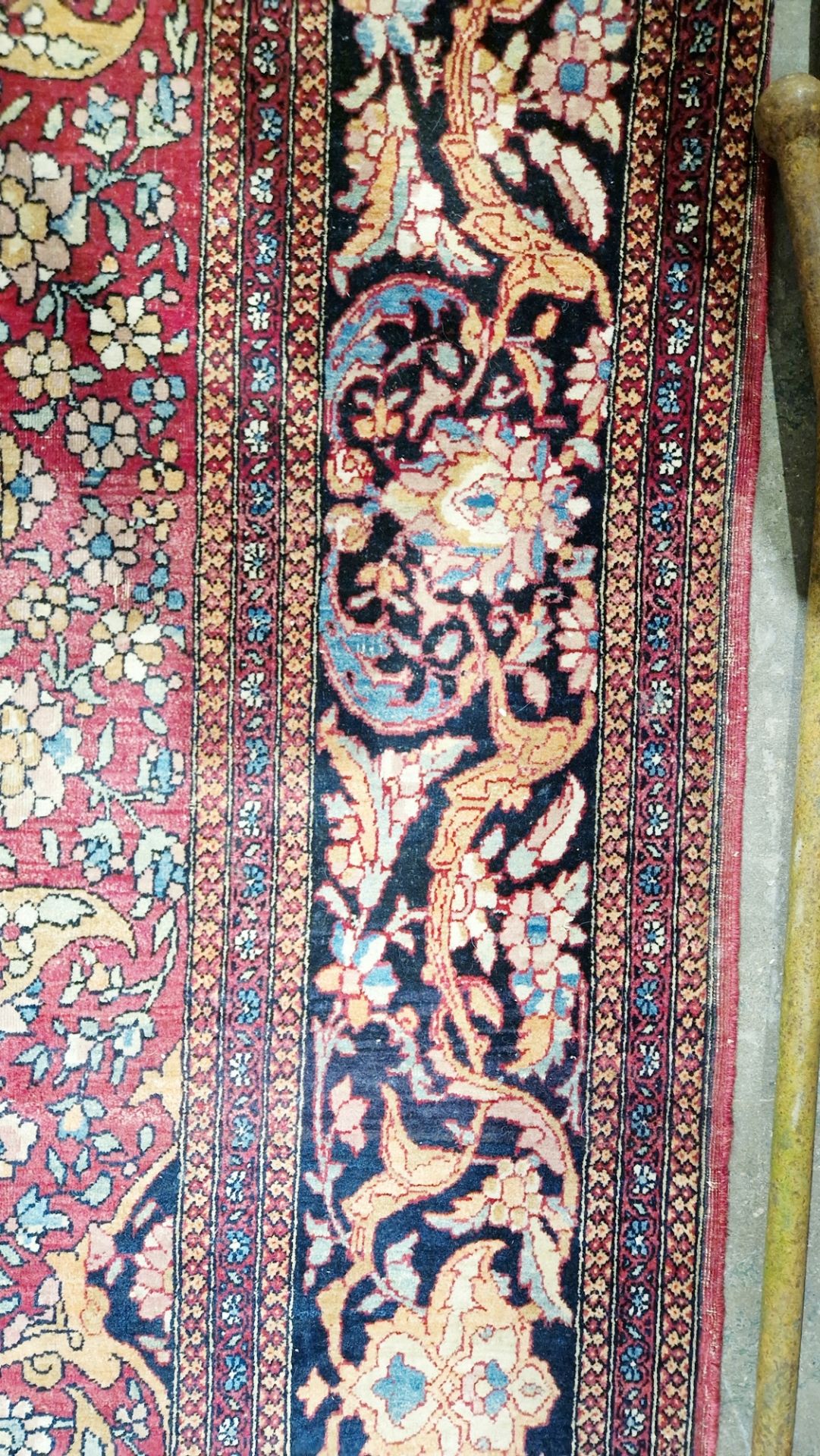 Eastern wool rug of Persian design, having black arabesque to the cherry red field with allover - Image 8 of 32