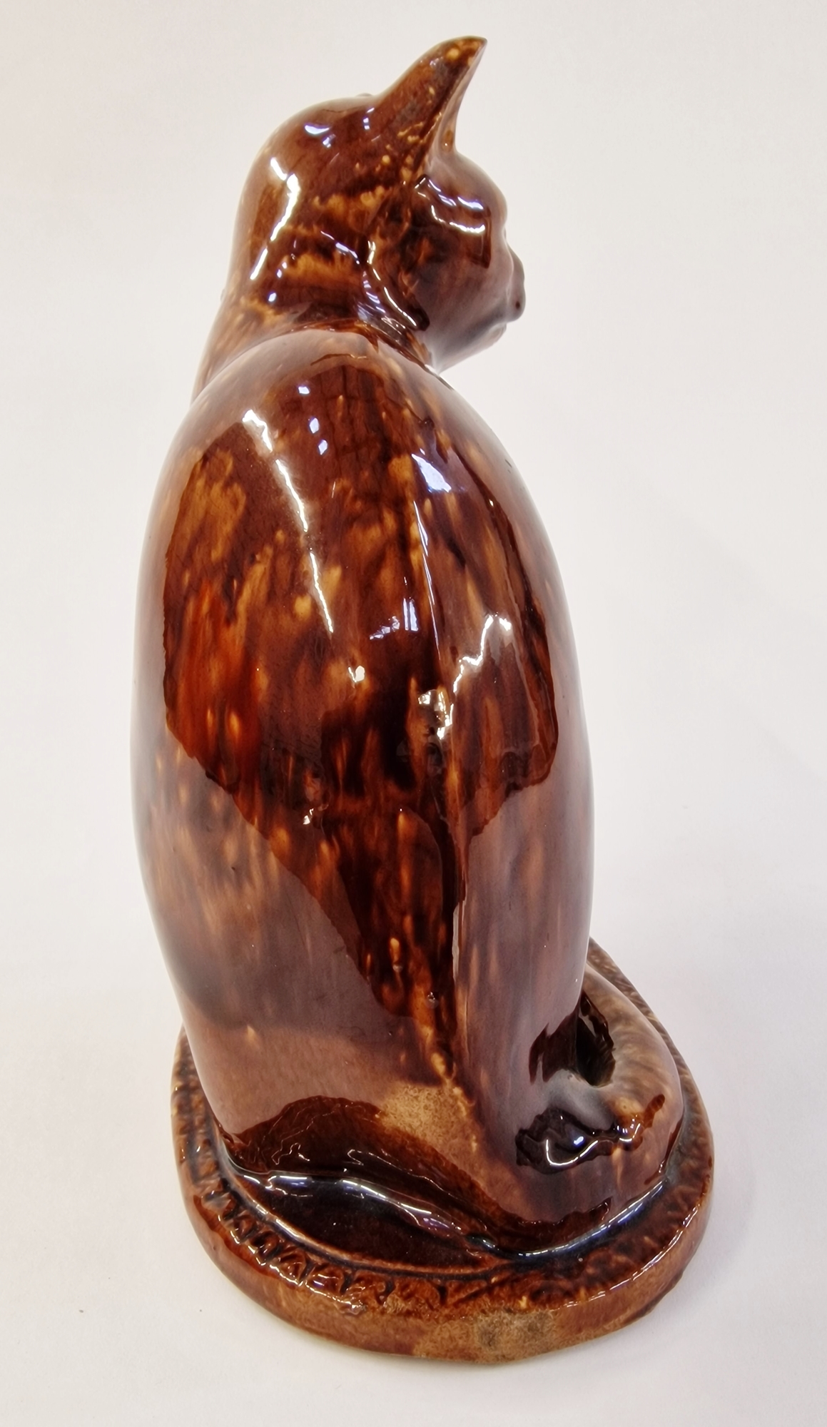 20th century pottery model of a cat, enriched in mottled brown Whieldon-style glaze, modelled seated - Image 4 of 4