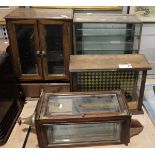 Wall cabinet with bevelled glass sides, fitted brass corners to the front opening drawer and a brass