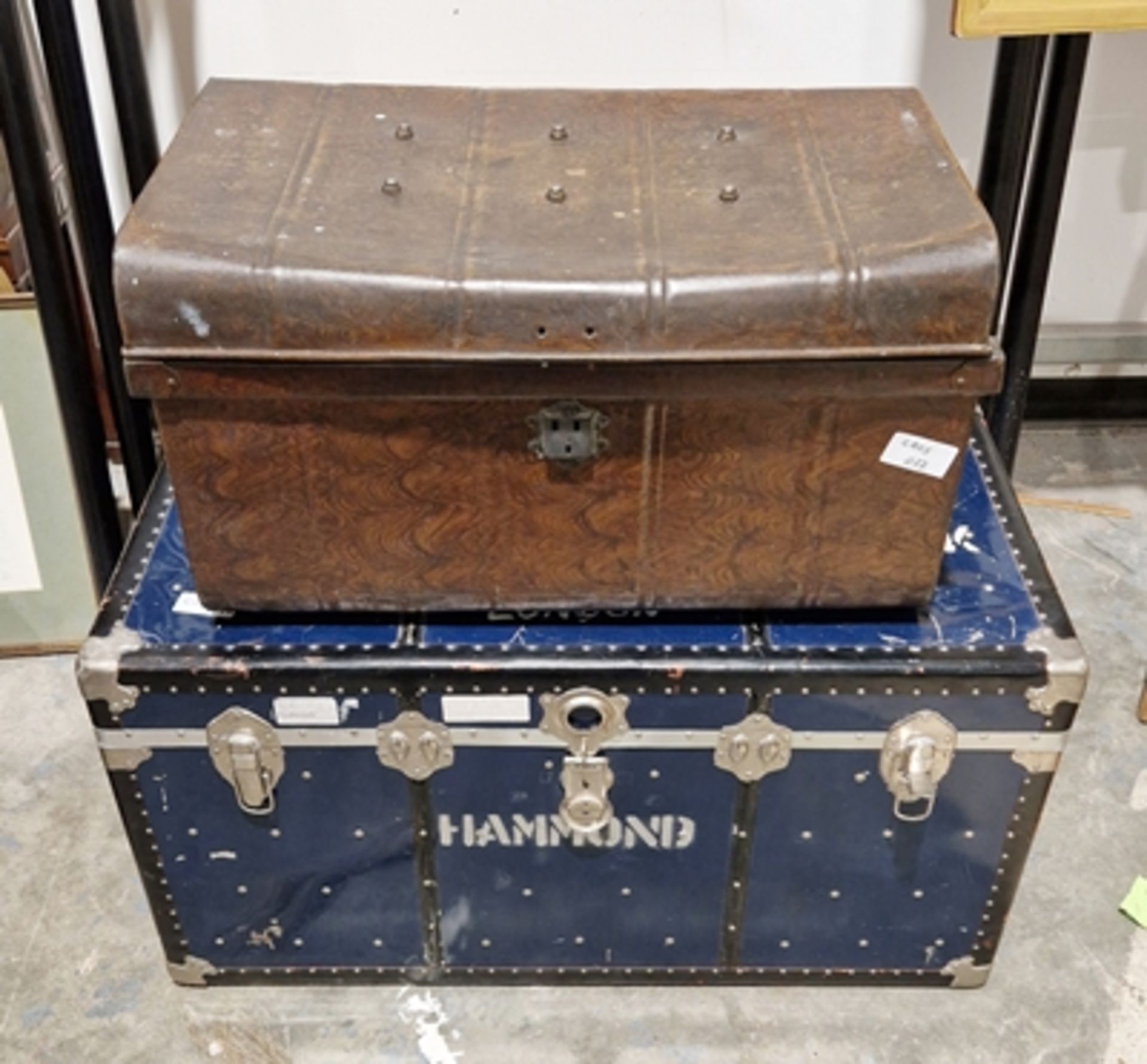 Large travelling metal trunk and a vintage tin trunk (2)