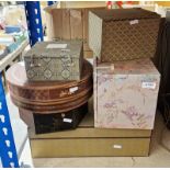 Three Chinese-style upholstered boxes, one bearing forest and mountain scene, the other two