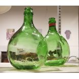 Pair of green glass demijohns (2)