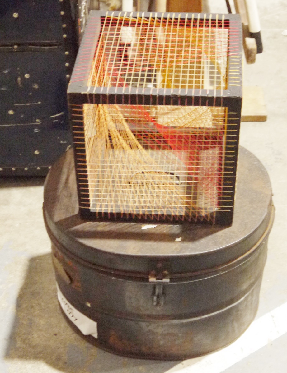 Metal hatbox and an unusual model consisting of a wooden cube strung with string (2)