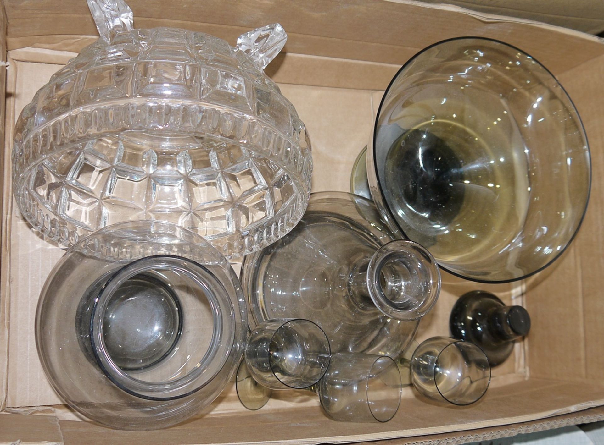 Modern smoked glass decanter with three matching sherry glasses, a matching comport, a matching vase