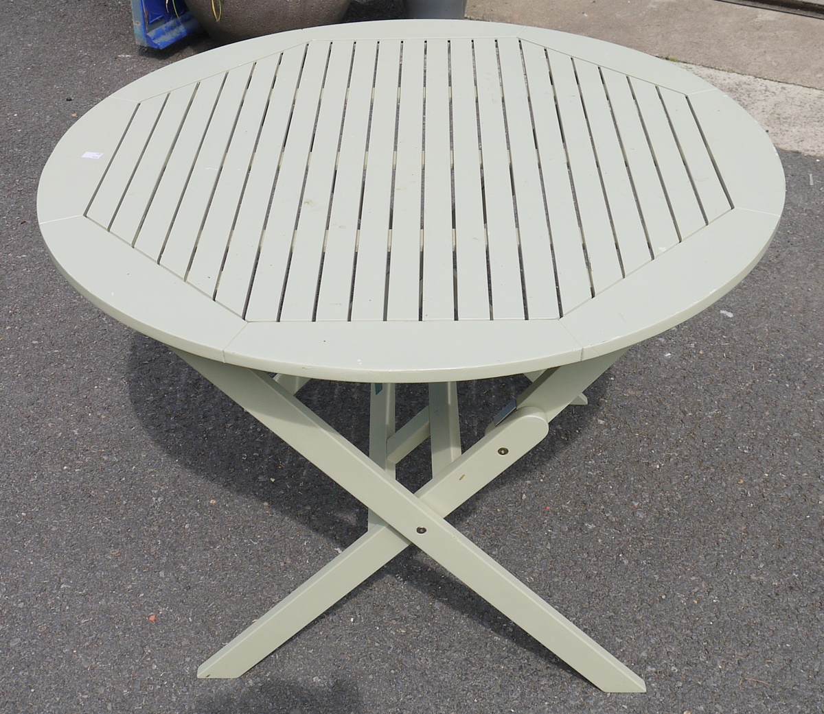 Pale green painted garden table, round, folding,  by 'Hartman', 100cm x 110cm