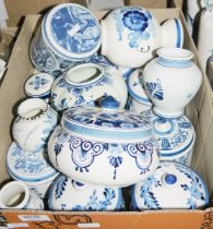 Quantity of blue and white Delftwares to include lidded ceramic bottles, Delft vase decorated with