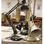 Three anglepoise-style lamps, one in white and two further in black (3)