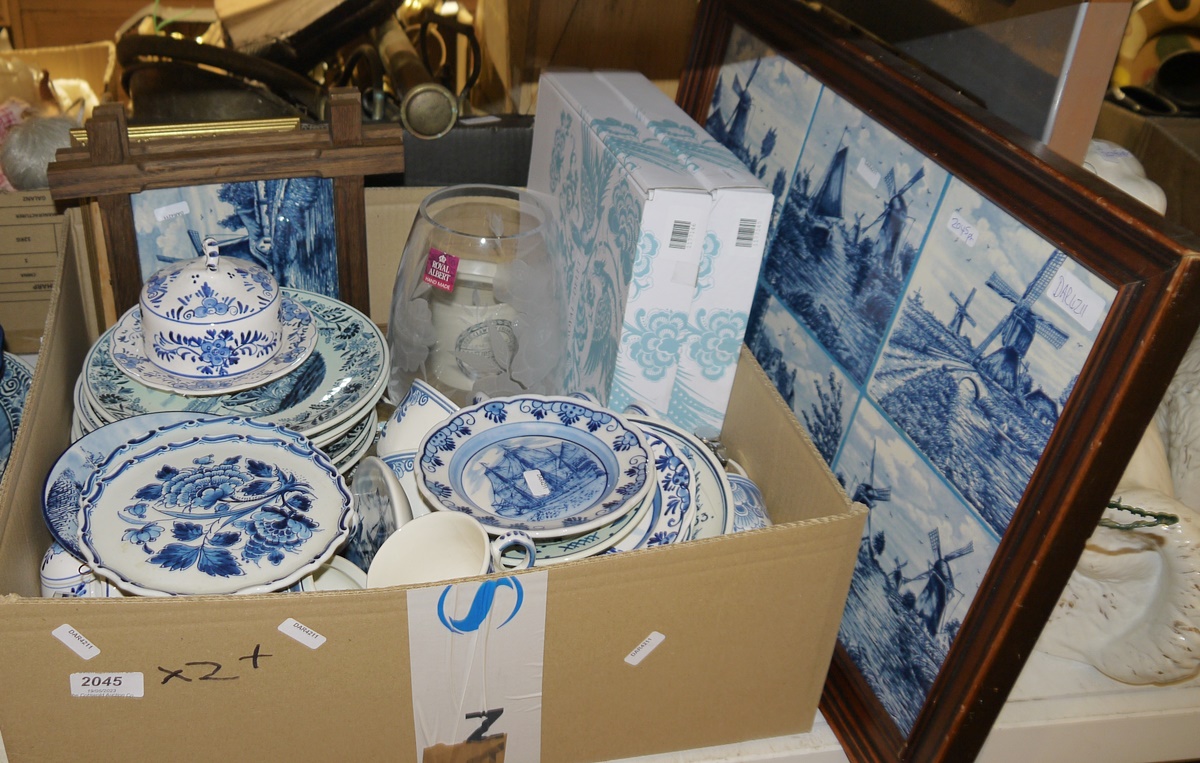 Quantity of delft blue wares to include four large plates and others with countryside scenes,