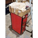 Red canvas and metal bound travelling trunk and a box of assorted textiles, table linen, vintage