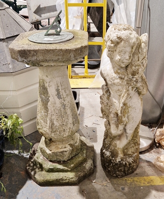 Composite stone three-section sundial and a composite stone white painted statue of a boy holding