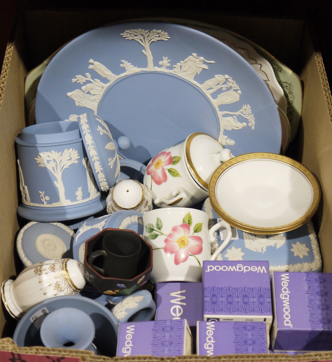 Large quantity of Wedgwood blue jasperware with typical decoration to include pots, plates, lidded