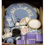 Large quantity of Wedgwood blue jasperware with typical decoration to include pots, plates, lidded