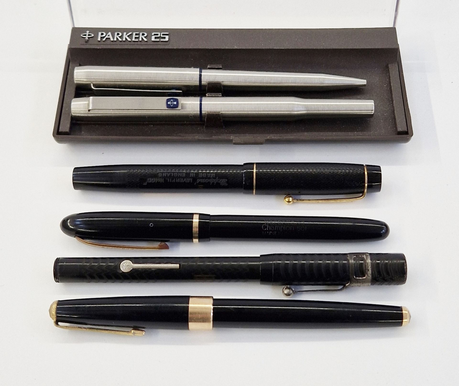 Waterman's Champion 501 fountain pen in black and gold, a Parker '17' fountain pen in black and
