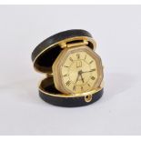 Dunhill gilt metal and leather travel clock, the gilt octagonal face, no.1829, within circular black