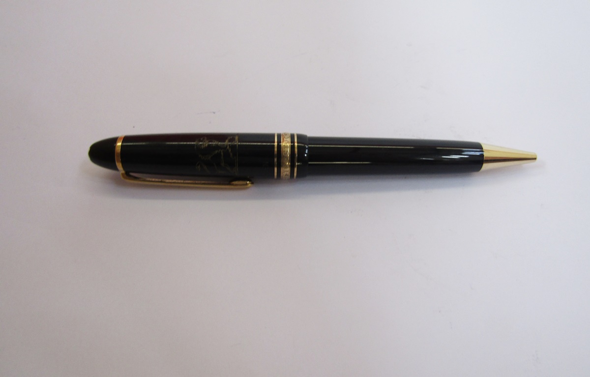 Montblanc Meisterstuck ball point pen, black with gold band decoration, engraved lion crest and name