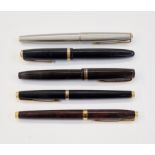 Parker Victory fountain pen in black and gold, a Parker Duofold fountain pen in black and gold, a