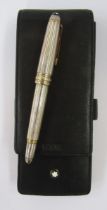 Montblanc Meisterstuck silver fountain pen, ribbed silver case with gold band detailing,