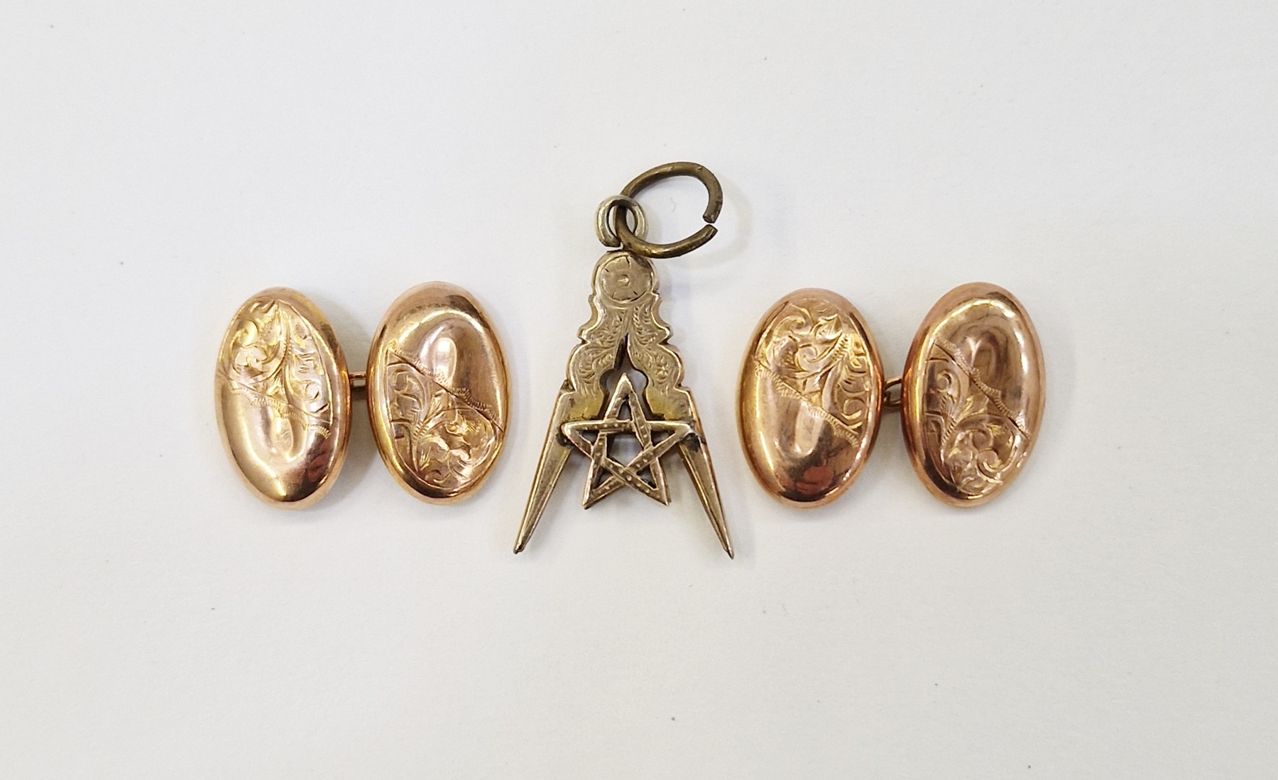 Pair of early 20th century 9ct gold cufflinks and a yellow metal Masonic pendant (2)