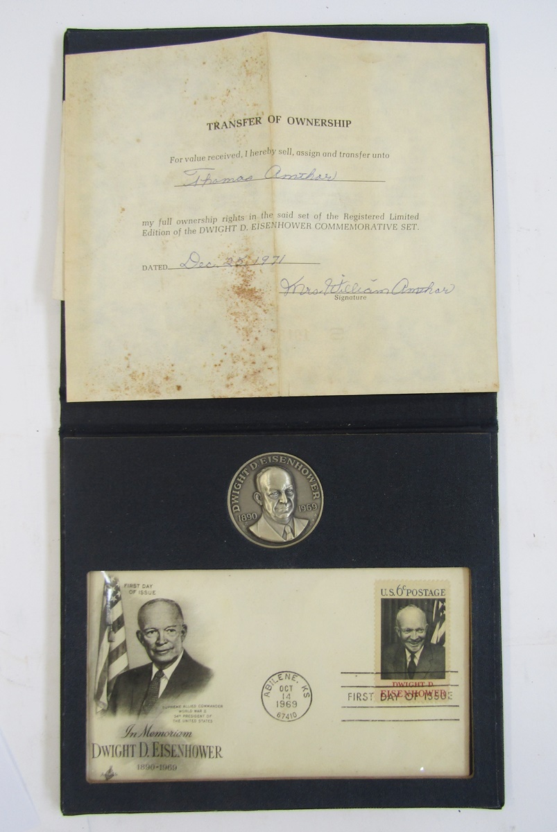 Eisenhower commemorative set made up of silver medallion and 6c postage stamp, and US numismatic