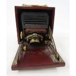 Early 20th Unicum bellow field camera, mahogany and brass bound case, marked Bausch and Lomb co