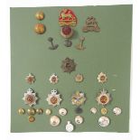 Collection of British Army cap badges, cloth badges, rank markings and shooting medals.