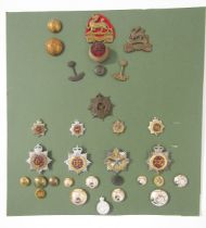 Collection of British Army cap badges, cloth badges, rank markings and shooting medals.