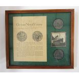 Two WWI RMS Lusitania medals with box and leaflet within glazed frame.