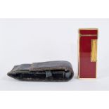 Dunhill lighter with gilt metal and oxblood lacquer, 6.5cm high, with Dunhill pouch
