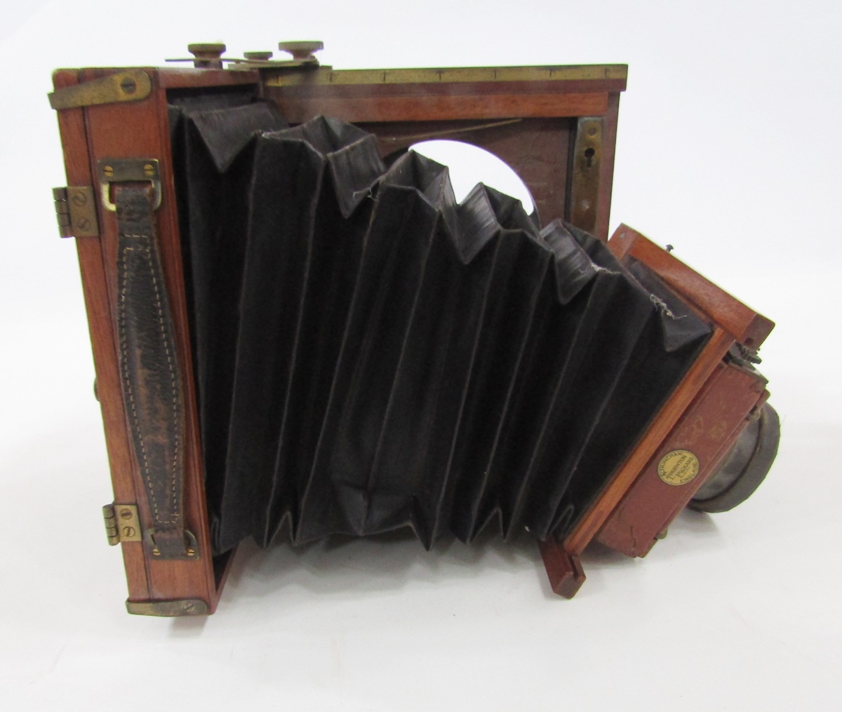 Late 19th/early 20th century Thornton Pickard Amber half plate mahogany cased field camera, patent