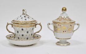 Two 19th century porcelain chocolate cups and covers, including a Chelsea Derby chocolate cup