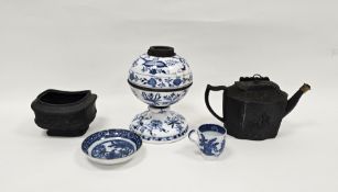 19th century black basalt teapot of lobed oval form with moulded decoration of classical figures