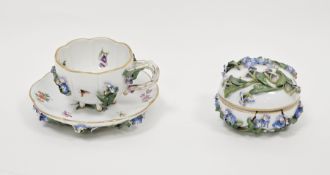 Late 19th century Meissen flower-encrusted teacup and saucer and a circular domed box and cover,