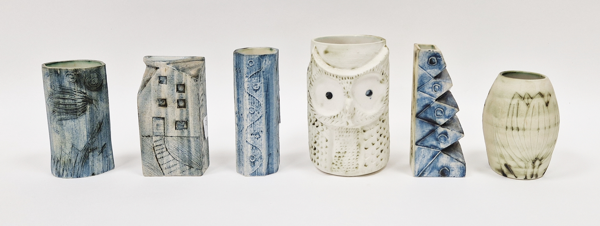 John Beusmans for Carn Pottery, a vase of cylindrical form with relief decoration of owl's face,