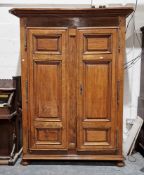 19th century French cherrywood armoire, the two panel doors opening to two later fitted pine