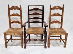 Ash ladderback elbow chair with rush seat, 62cm wide x 108cm high, and a pair of beech ladderback