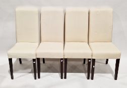 Set of four Oka Furniture dining chairs with calico upholstered padded seats and backs, raised on