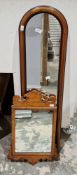 Two mirrors including a 19th century walnut framed fretwork mirror, 57cm high and, an early 20th