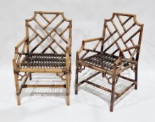 Pair of Chinese Chippendale revival bamboo conservatory elbow chairs in the George III manner, one