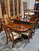 Reproduction George III mahogany dining room suite comprising an extending twin-pedestal dining